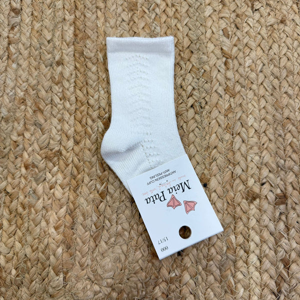 Calzino alto a costine panna con ponpon