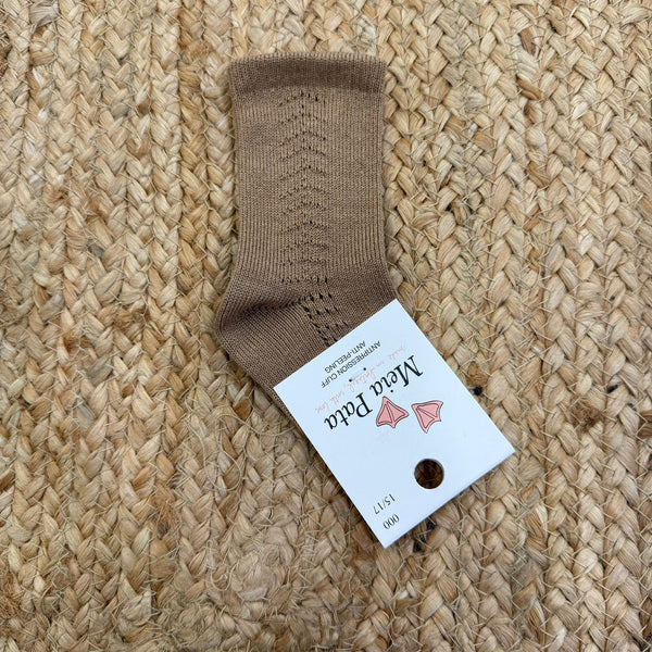 Calzino alto traforato lateralmente