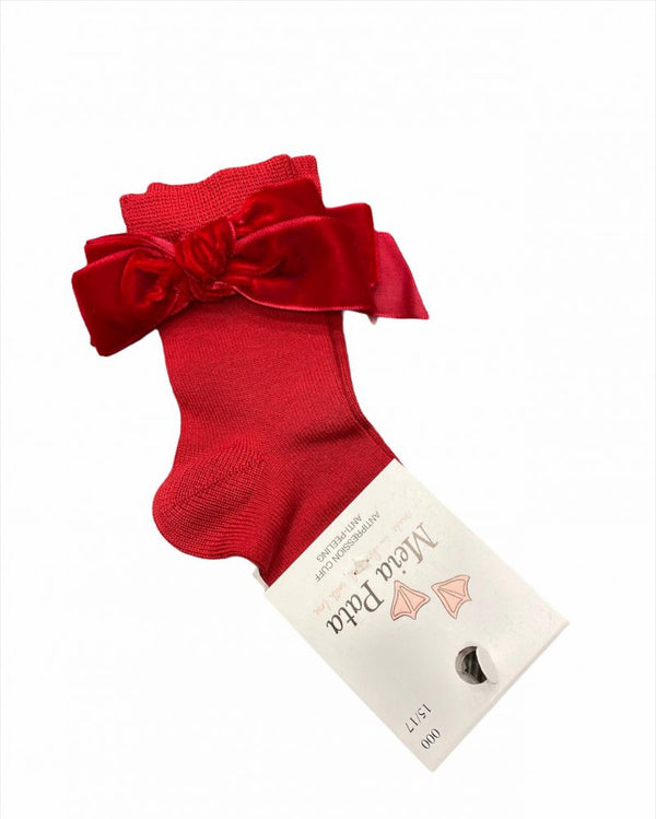 High sock with red velvet bow